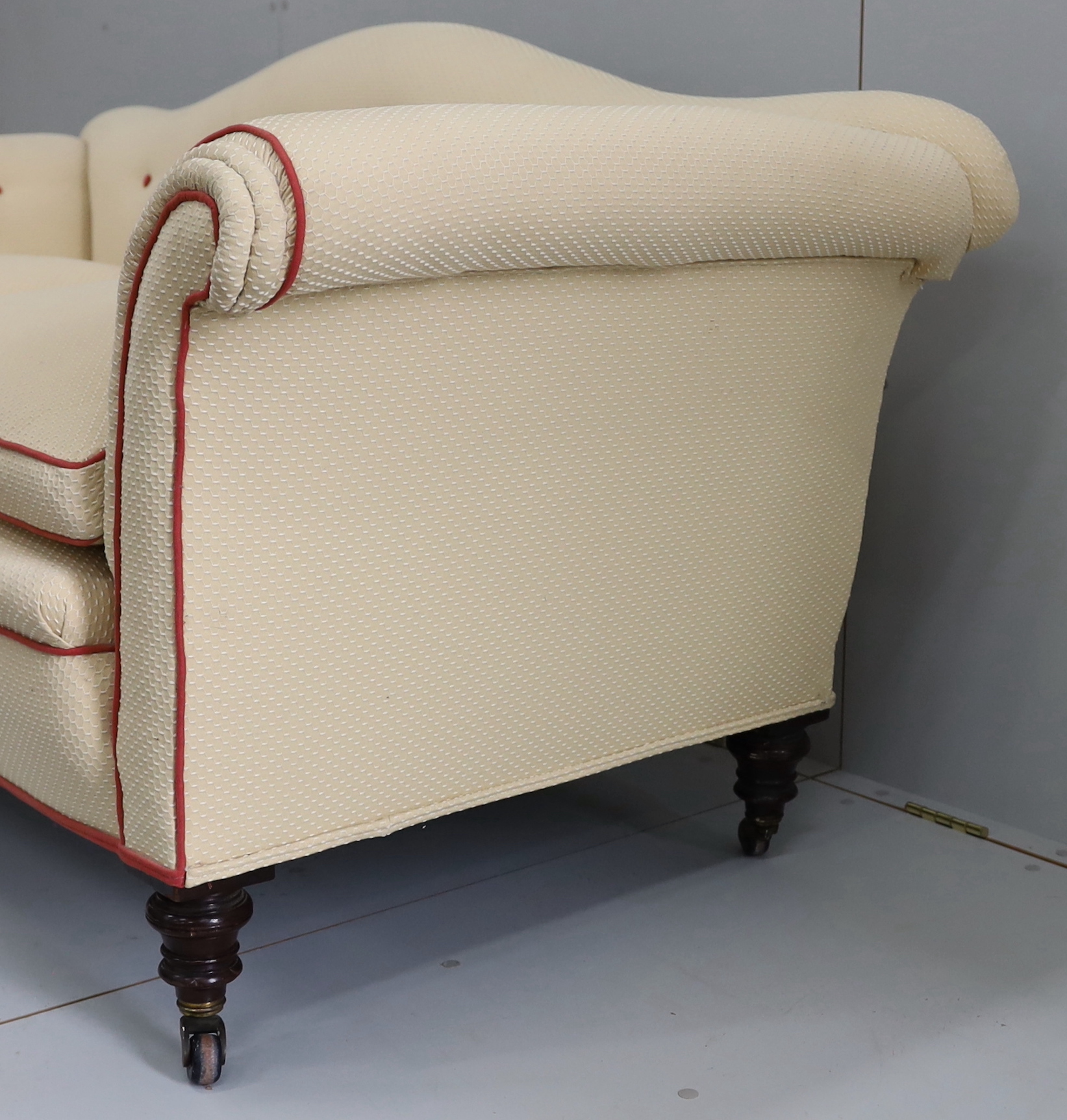A late Victorian upholstered scroll arm two seater settee, length 176cm, depth 78cm, height 84cm